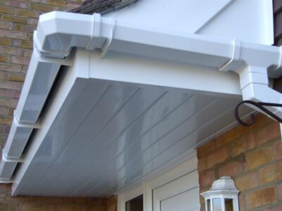 White soffit and guttering above a front door